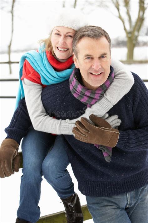 Senior Couple Walking Dog Through Snowy Woodland Stock Image Image Of