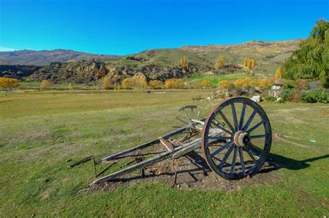 Premium Photo Wagon Wheel On Field Against Sky