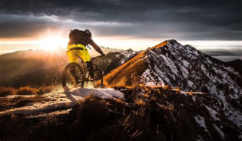 Download Thrilling MTB Ride on a Snow-Covered Mountain Wallpaper ...