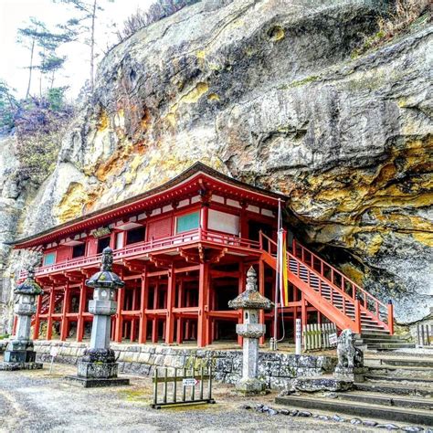 A Cave Of Secret Relics Buried In A Sheer Cliff With A Temple Built