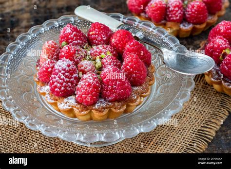 Raspberry And Pistachio Tarts Stock Photo Alamy