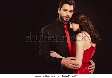 Handsome Man Embracing Beautiful Woman Red Stock Photo 1676113672