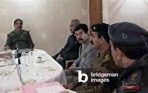 Image Of Iraqi President Saddam Hussein With His Two Sons Uday And