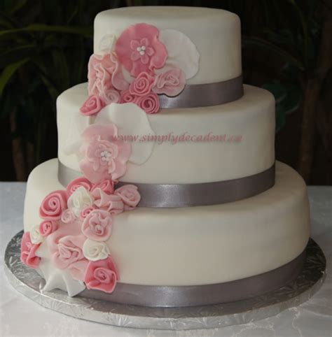 3 Tier Fondant Wedding Cake With Spray Of Pink Fondant Flowers - CakeCentral.com