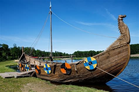 Premium Photo Drakkar Viking Boat Moored Near The Grassy Shore