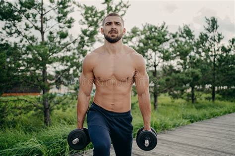 Sport And Recreation Concept Muscular Unshaven Sporty Man Holds Heavy