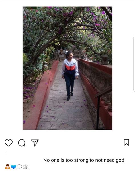 A Woman Walking Down A Path With Trees On Either Side