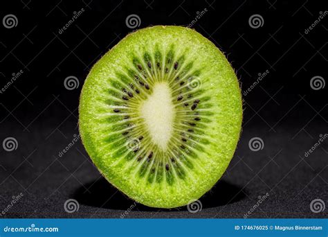 Detailed Cross Section Of A Fresh Illuminated Kiwi Fruit Cut In Half