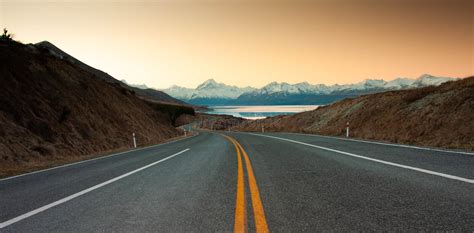 Scenic Winding Road Along Lake Pukaki To Mount Cook National Park