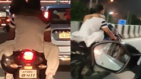 Couple Doing Stunt By Sticking To Bike Up Police Fined 21 Thousand Viral Video बाइक पर चिपककर