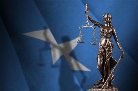 Premium Photo Somalia Flag With Statue Of Lady Justice And Judicial