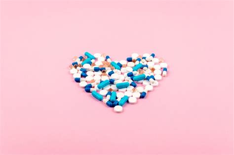 Premium Photo Blue And White Pills And Tablets In Heart Shape