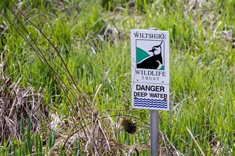 Close Up Of Wiltshire Wildlife Trust Danger Deep Water Sign At