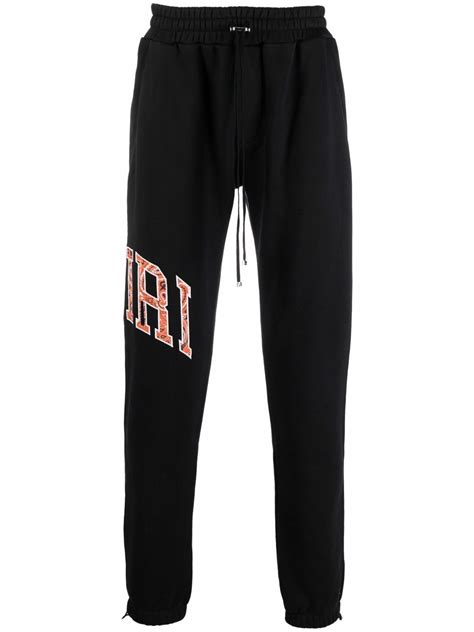 Amiri Side Logo Print Track Pants In Black Modesens