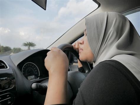 Premium Photo Asian Muslim Lady Slept In Her Car Tired In The Trip Taking Nap By The Side Of