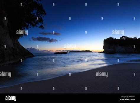 Cathedral Cove at sunrise Stock Photo - Alamy