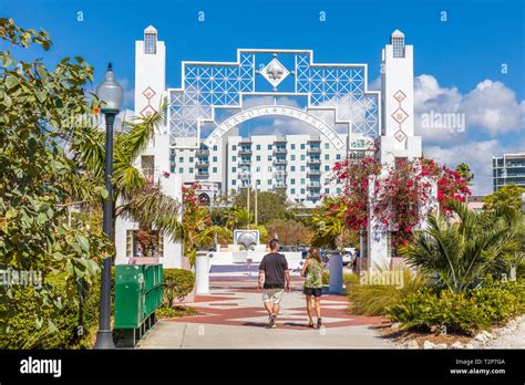Couple Walking At Entrance To Sarasota Bayfront Park In Sarasota