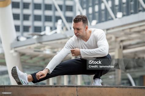 Fitness Man Stretching Legs In Urban City Sport Exercise Workout