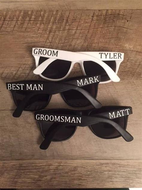 Three Pairs Of Sunglasses That Say Grooms Best Man And Groomsman On Them