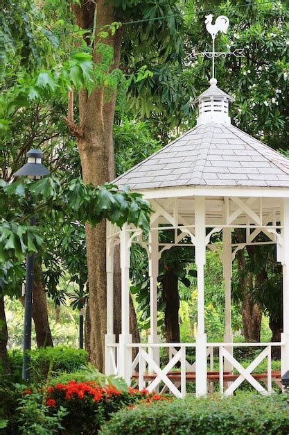 Premium Photo | White wooden gazebo in the garden