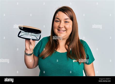 Beautiful Brunette Plus Size Woman Holding Glasses In Eyewear Case Looking Positive And Happy