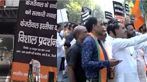 Kejriwal Must Resign Bjp Puts Posters Outside Aap Office Amid Ed