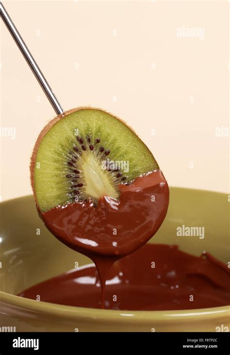 Chocolate Fondue Kit And Fruits Stock Photo Alamy