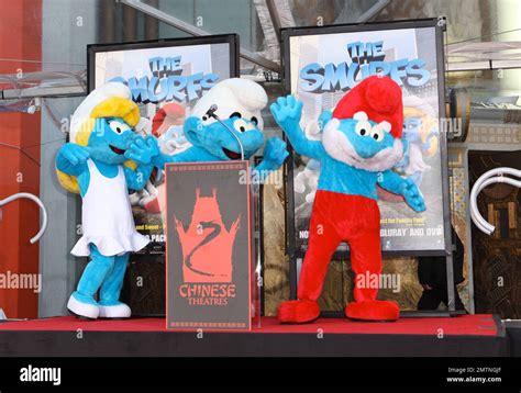 Papa Smurf Clumsy And Smurfette At The Smurfs Handprint And Footprint Ceremony Held At Grauman