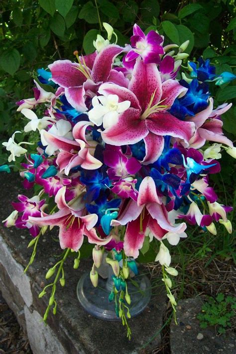 Gorgeous Cascading Wedding Bouquet Featuring Hot Pinkwhite Stargazer Lilies White Dendrob