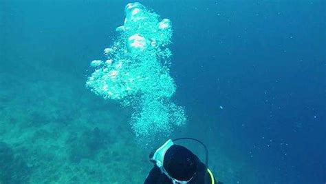 Slow Motion View Of Exhaled Scuba Diver Bubbles Rising To Ocean Surface