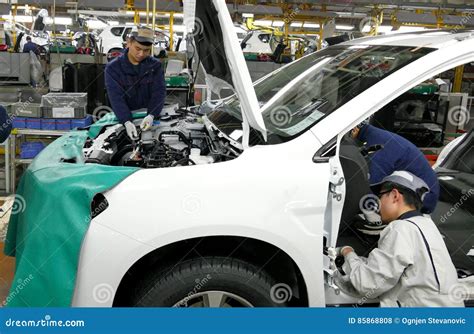 Workers Assemble A Car On Assembly Line In Car Factory Editorial Stock