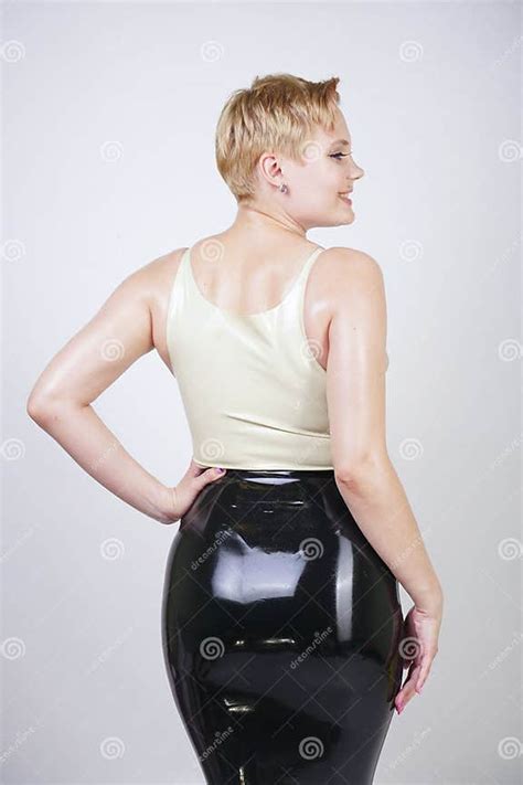 Hot Short Hair Blonde Girl With Curvy Body Wearing Latex Rubber Dress