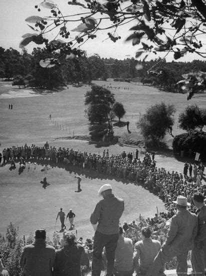 Spectators Watching As Men Compete In The Golf Tournament Riviera