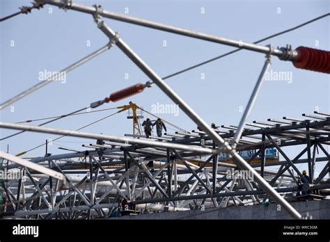 Chinese Migrant Workers Labor At The Construction Site Of The Huai An