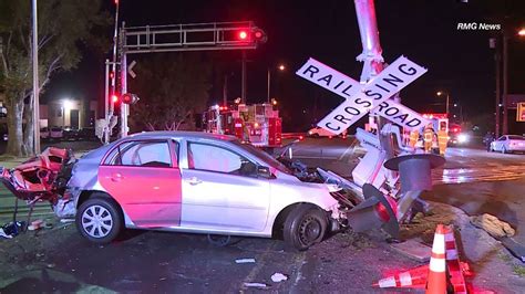 Good Samaritans Pull Woman From Car Moments Before Train Crashes Into