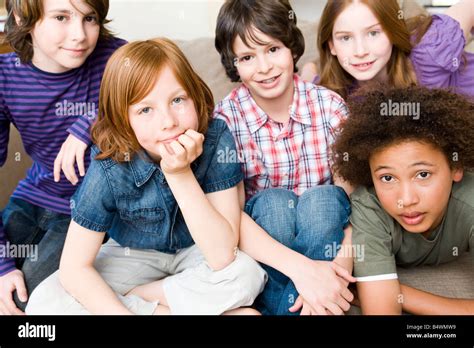 Four Boys One Girl Looking Up To Camera Stock Photo Alamy