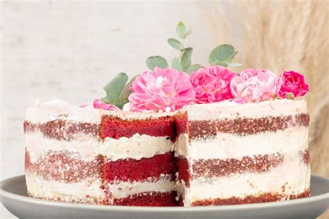 Red Velvet Naked Cake With Fresh Roses And Swiss Buttercream On Kitchen