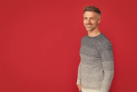 Premium Photo Cheerful Handsome Man Wear Sweater On Red Background