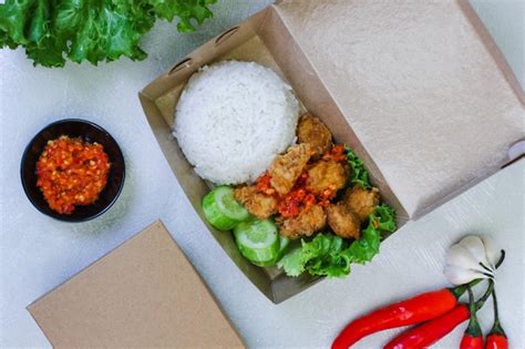 Premium Photo Crispy Chicken Rice With Chili Sauce In A Box On A