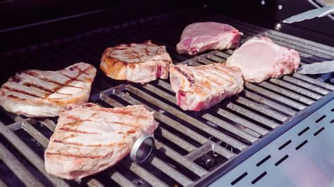 Premium Photo Grilling Pork Chops On Gas Grill In The Summer