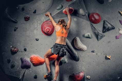 Free Photo Athletic Brunette Female On Indoor Climbing Wall