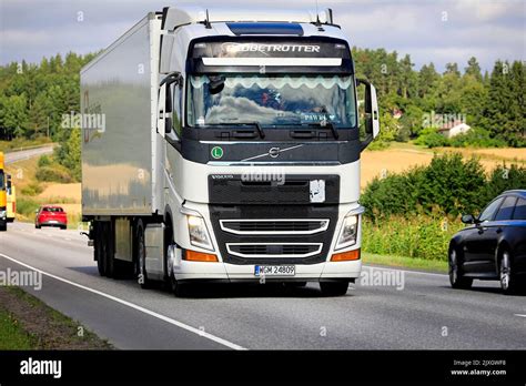 White Volvo Fh Truck Globetrotter Cab Pulls Semi Trailer In Highway