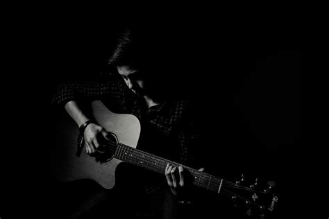 HD wallpaper: man playing guitar on black background, person playing ...