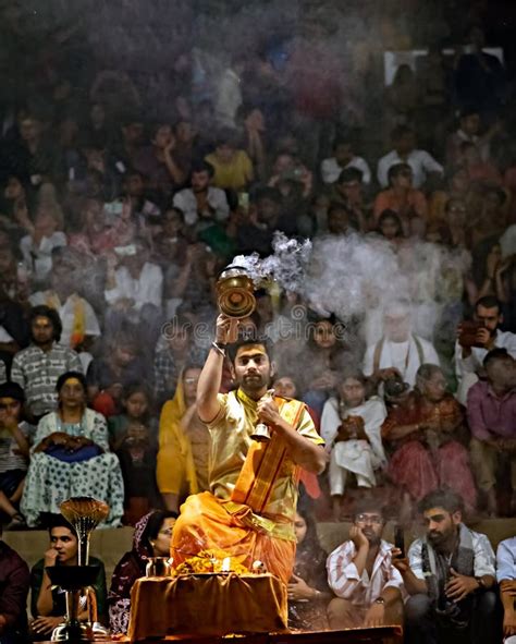 Priest Performing Ganga Aarti On Banks Of Holy River Ganges In One Of