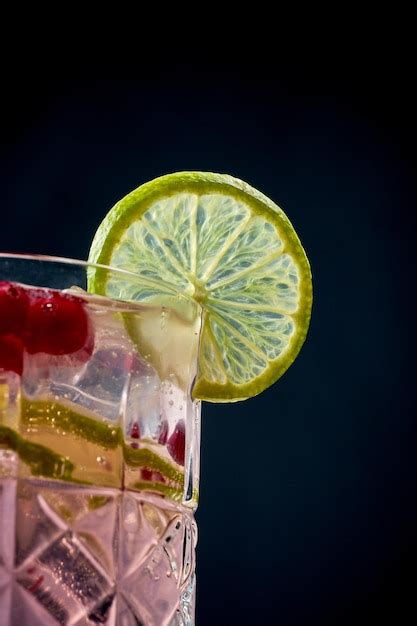 Premium Photo Alcoholic Pink Cocktail With Cranberry And Ice In A