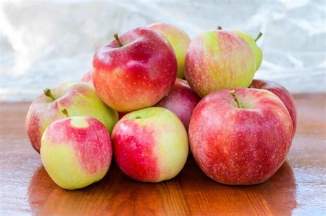 Premium Photo Fresh Ripe Apples On A Wooden Table Apples