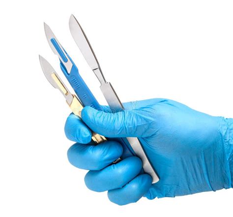 Scalpel In The Hands Of Doctor In Gloves On White Background Surgeon