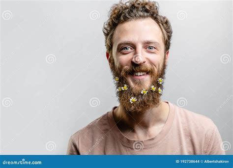 Handsome Hipster Man With Beard Smiling At Camera Over White Background