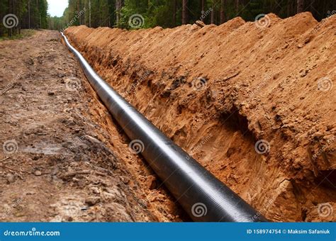 Natural Gas Pipeline Construction Work A Dug Trench In The Ground For