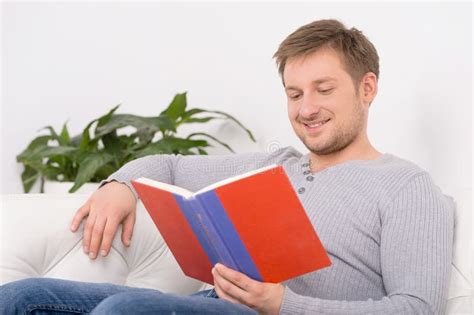 Reading A Book Together Handsome Young Men Reading A Book To Hi Stock